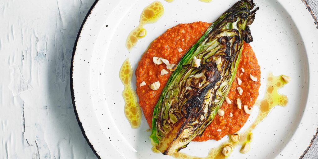 Charred hispi cabbage with hazelnut romesco