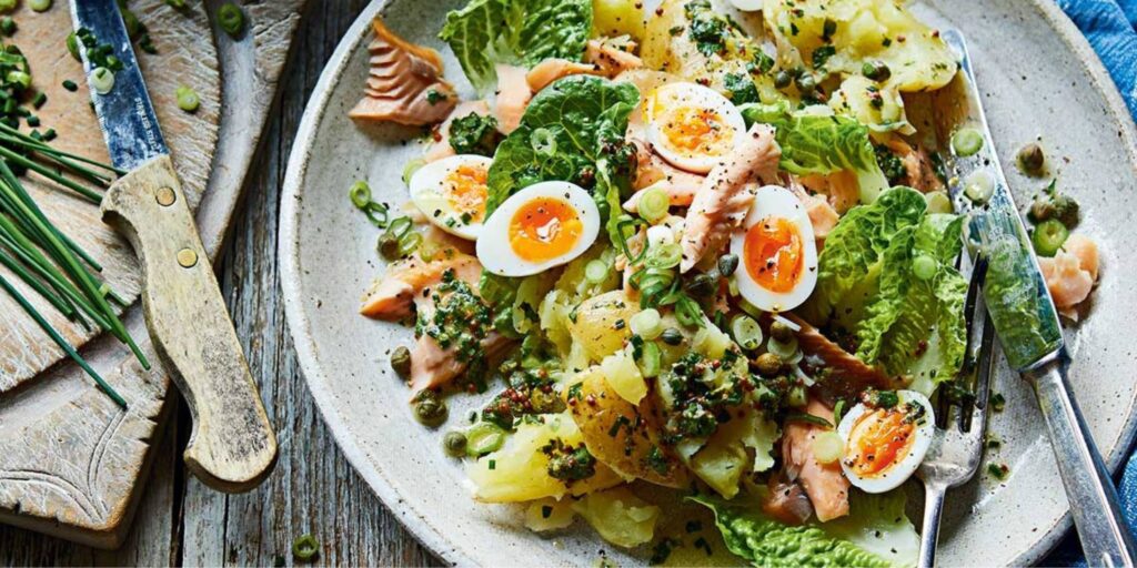 Warm Jersey Royal salad with hot-smoked trout and herby vinaigrette