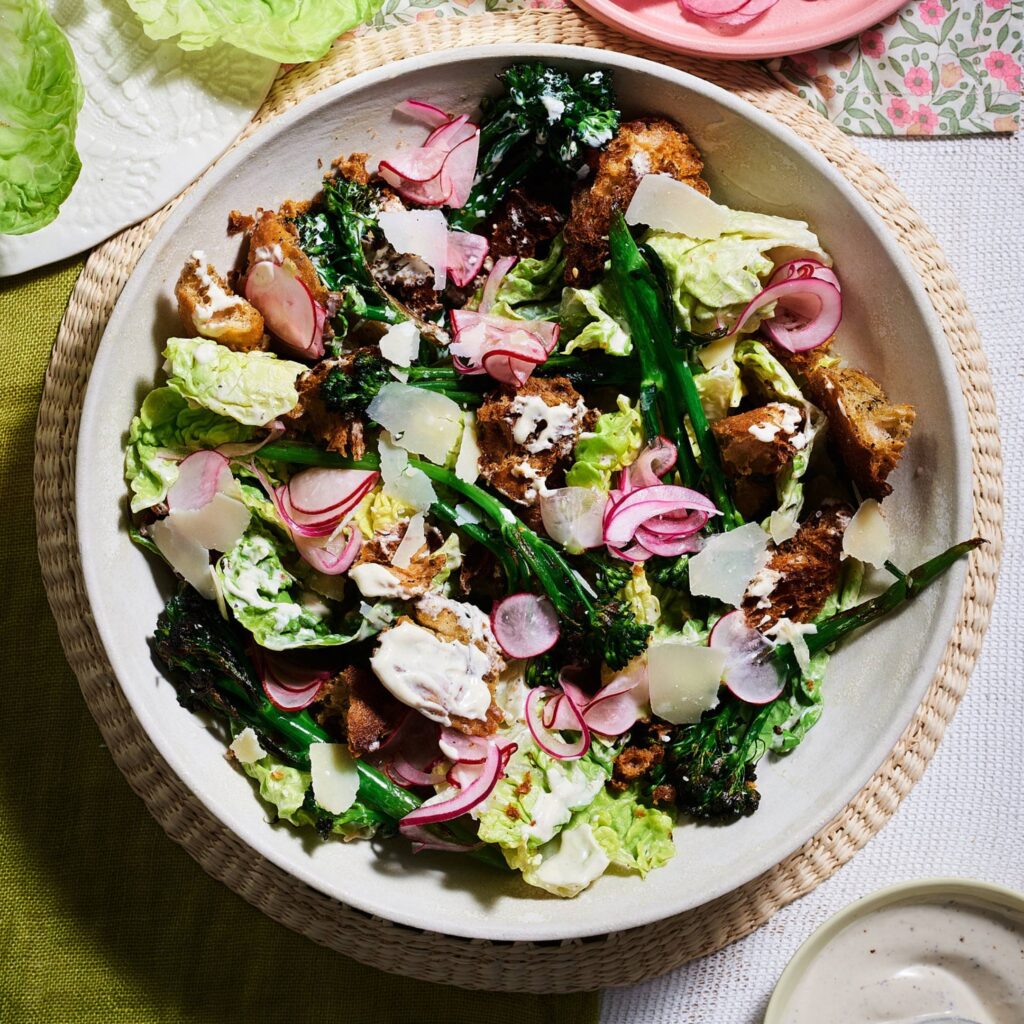 Charred broccoli salad with za’atar croutons, pickled radish and onions