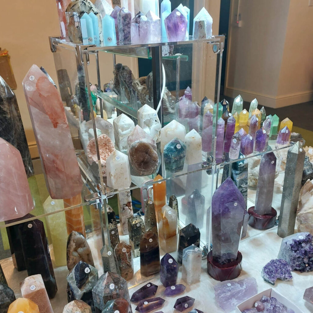 Glass display of various crystals in different sizes, shapes and colours.