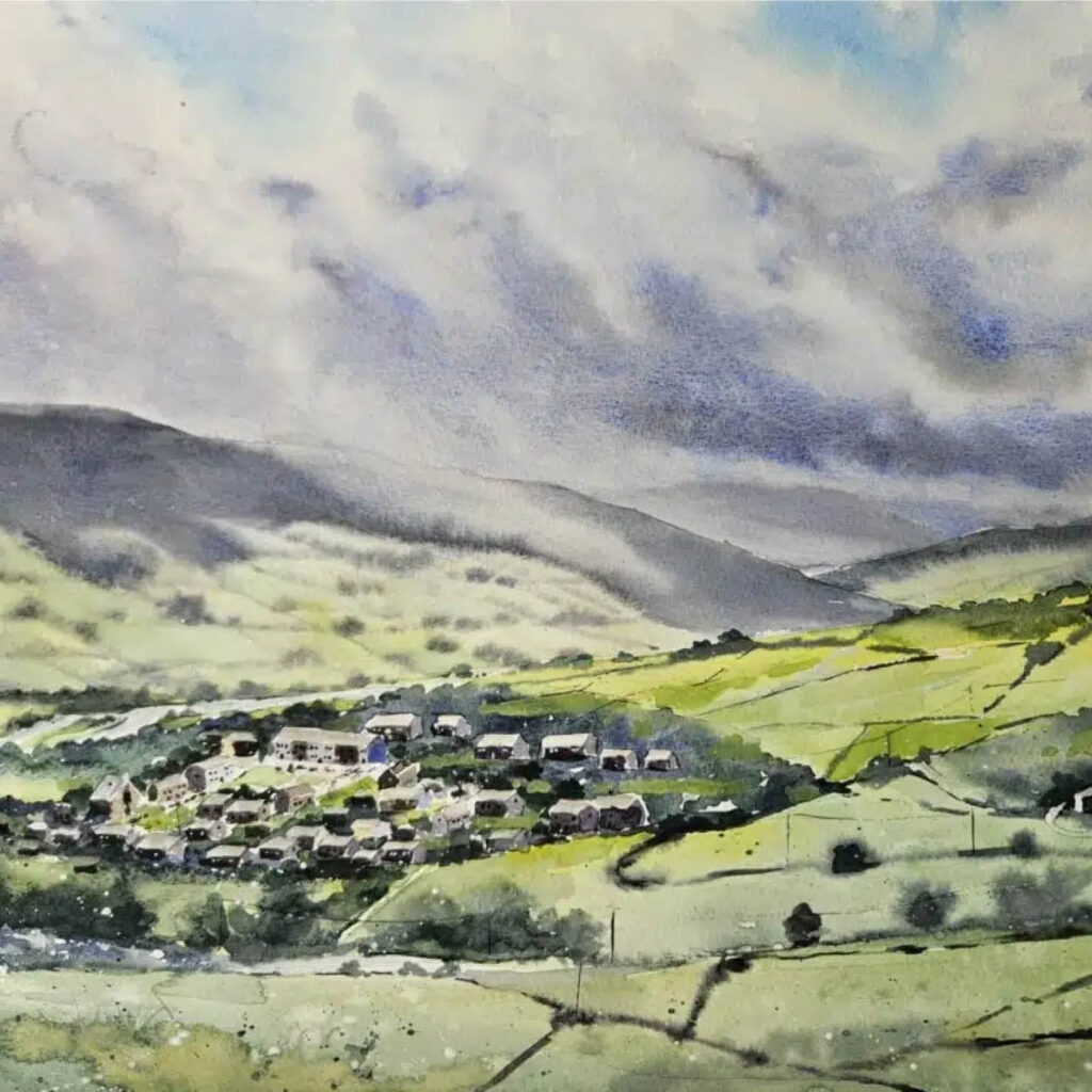 Watercolour landscape by artist Matt Scott. It depicts a village surrounding by rolling green fields. A blue sky peaks out from behind grey clouds.