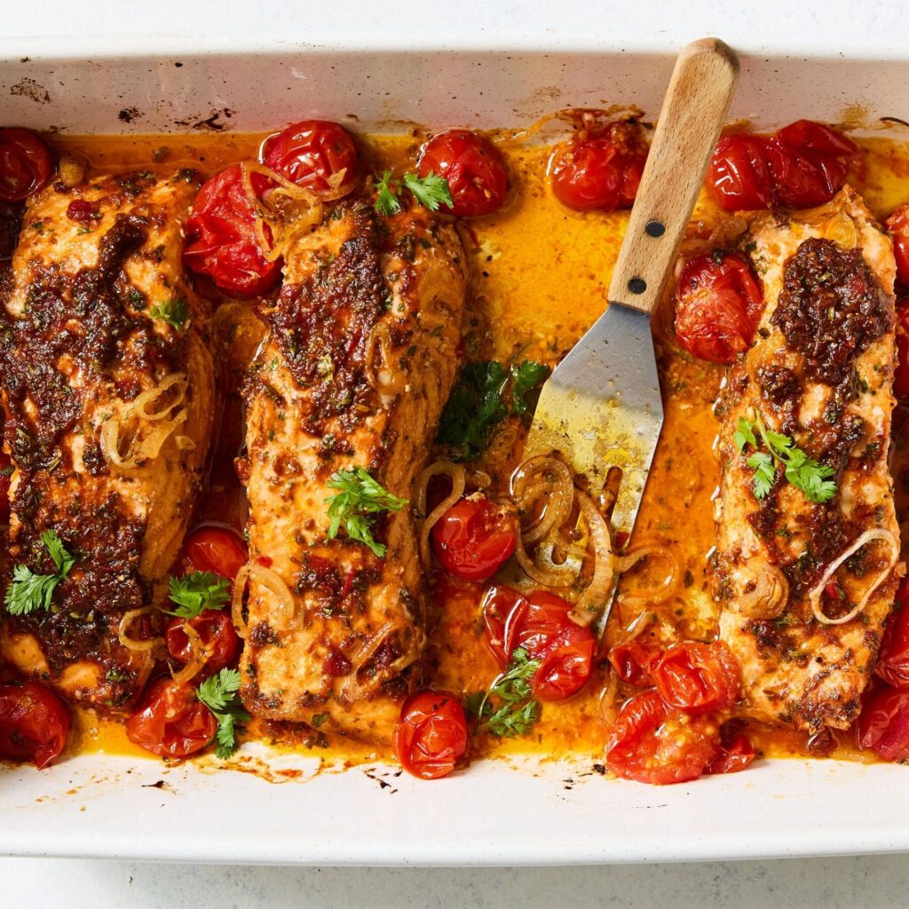 Baked salmon with harissa and cherry tomatoes