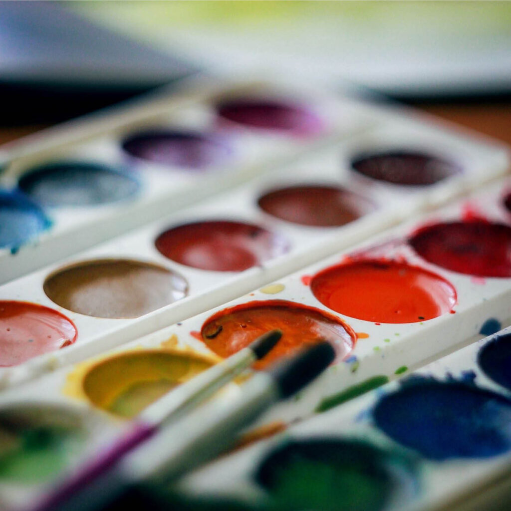A palette of watercolour paints.