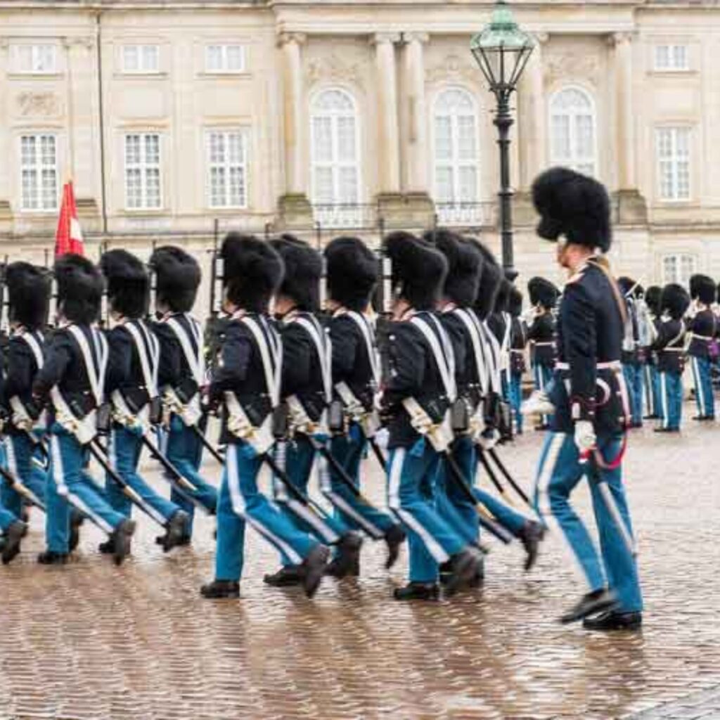 Royal Guards march through the city from Rosenborg Castle to Amalienborg Palace