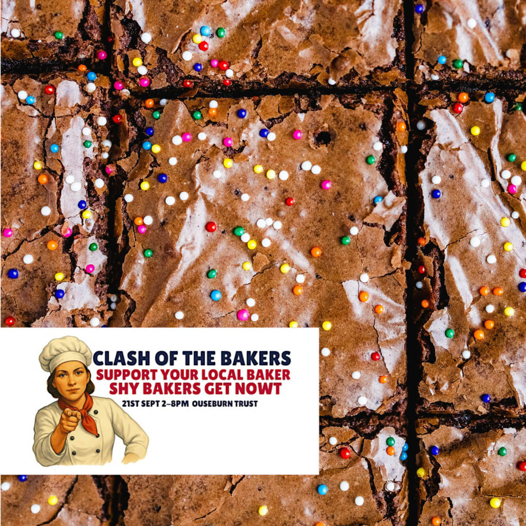 Chocolate brownies sprinkled with tiny rainbow balls. A small white tag features an image of a woman wearing a chef's hat and pointing. Text next to her reads: Clash of the Bakers.