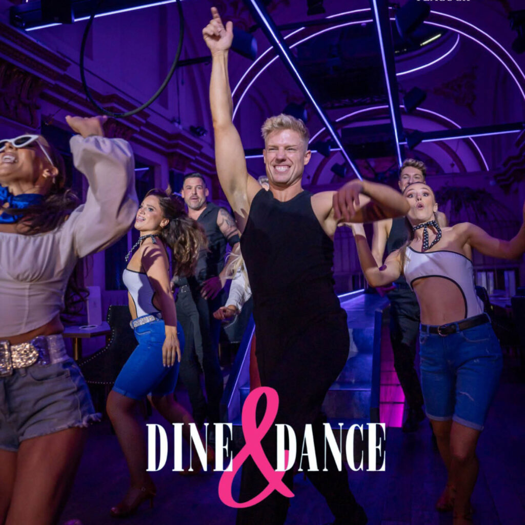 Dancers raise their arms in the air and grin as they perform during a Dine and Dance experience at The Purple Peacock, Newcastle.