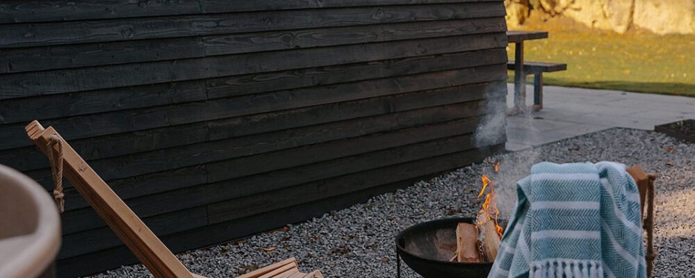 Outside shot of the firepit area of Hewn, Yorkshire