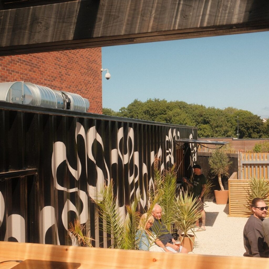 Low Quay Brew Co outdoor seating with converted shipping-container bar, North Shields Fish Quay.