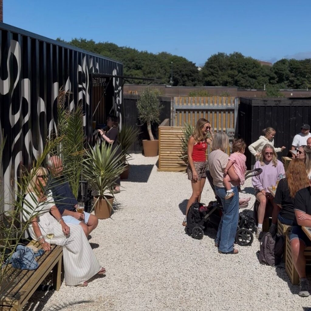 Low Quay Brew Co outdoor seating with converted shipping-container bar, North Shields Fish Quay.