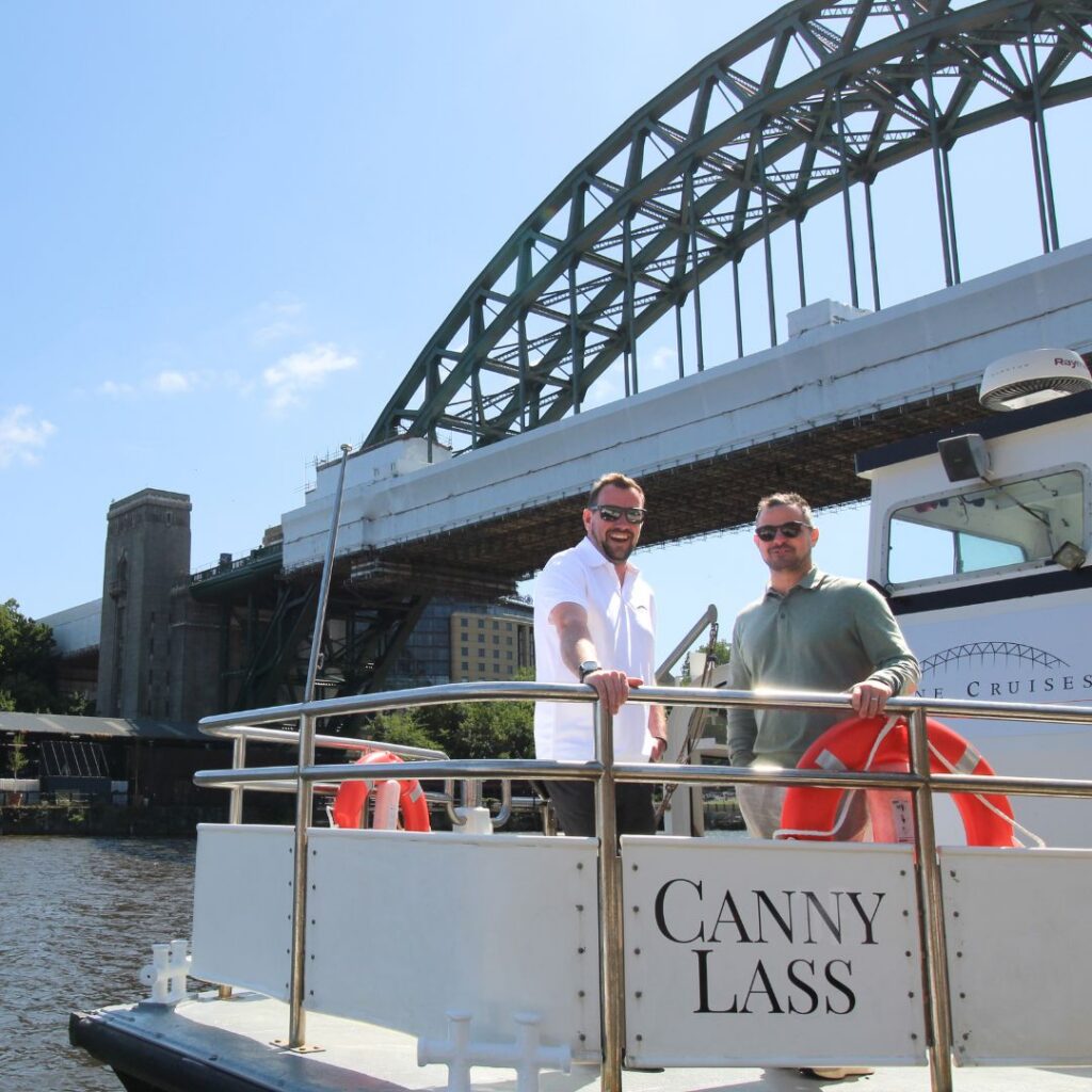The Canny Lass Signage in front of the Tyne Bridge - Tyne Cruises