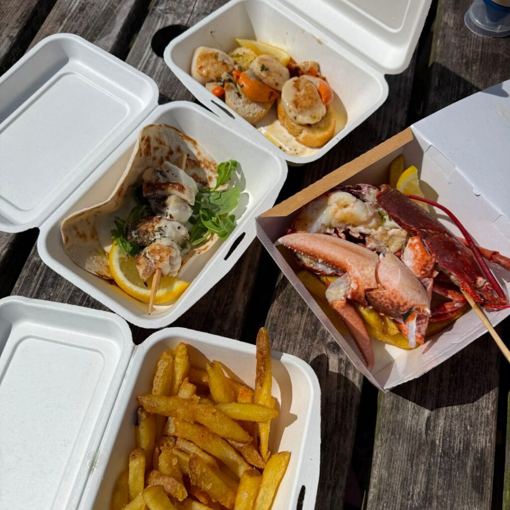 Monkfish kebab, scallops and half lobster with fries from Creel & Reel, Bamburgh