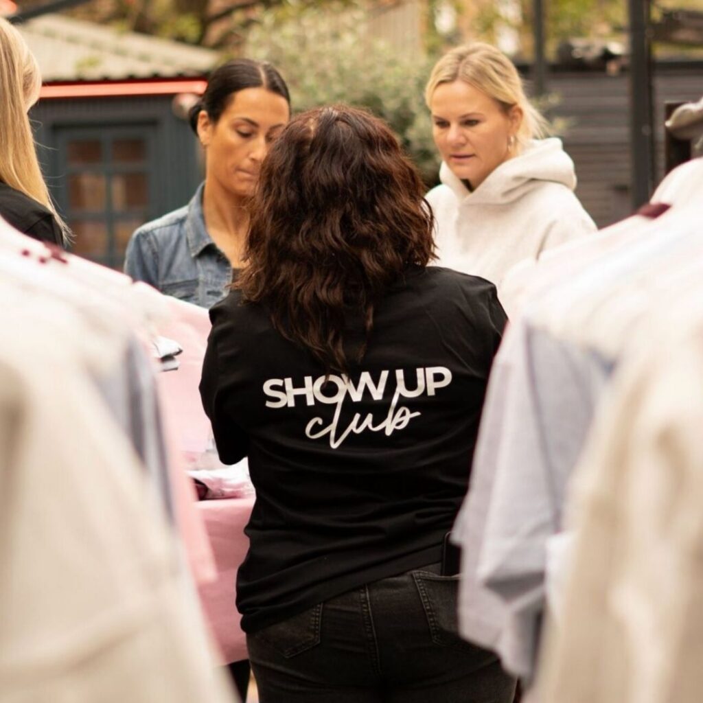 Show Up Club Logo on a T- shirt