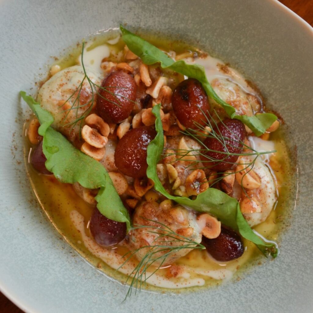 San Sabino style Ricotta Gnudi with roasted grape sauce